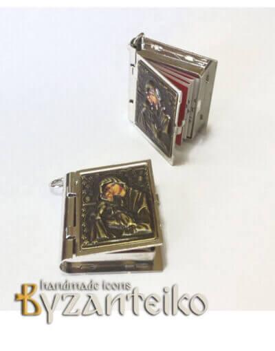 Metallic booklet with "Our Father"